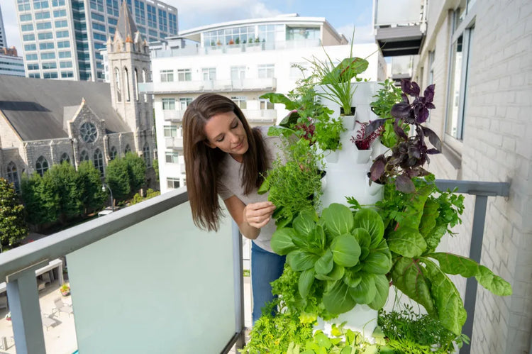 Tower Garden growing outdoors with fresh vegetables